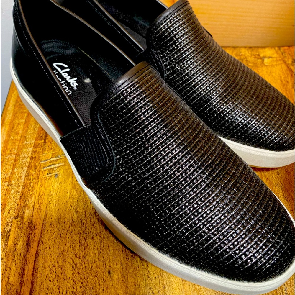 These are a Clarks Collection black slide on canvas in a  size 8.5.